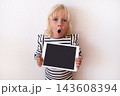 Happy Little Blonde Girl Holding Digital Tablet with Blank Screen  143608394