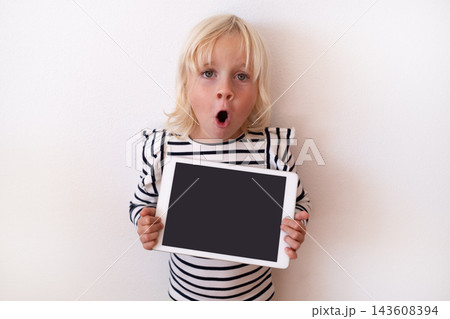 Happy Little Blonde Girl Holding Digital Tablet with Blank Screen Happy Little Blonde Girl Holding Digital Tablet with Blank Screen 143608394