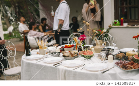 Guests Standing Beside A Wedding Reception Table Guests Standing Beside A Wedding Reception Table 143609817