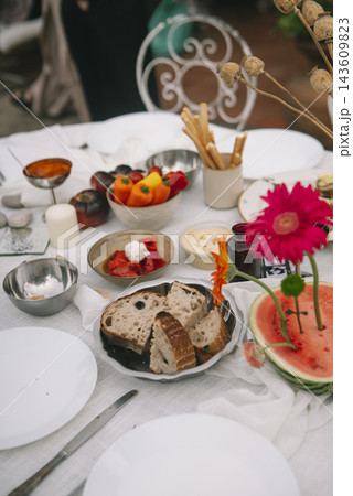 Close Wedding Table Detail With Flowers And Bread Close Wedding Table Detail With Flowers And Bread 143609823