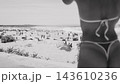 Crowded beach with foreground figure and ocean horizon 143610236
