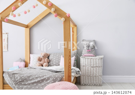 Stylish child room interior with comfortable bed 143612074