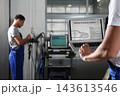 Mechanic with laptop doing car diagnostic at automobile repair shop, closeup. Space for text 143613546