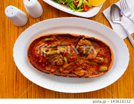 Izmir kofte - Turkish traditional meatball with chickpeas and sauce Izmir kofte - Turkish traditional meatball with chickpeas and sauce 143618132
