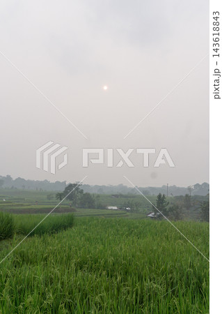An aerial view of the Indonesian landscape in the morning, shrouded in smoke from burning forests and rice fields 143618843