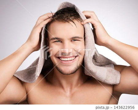 Studio, towel and man in portrait for haircare, collagen and cosmetic after shower with confidence. White background, male model and fabric for freshness, hygiene and healthy routine as treatment Studio, towel and man in portrait for haircare, collagen and cosmetic after shower with confidence. White background, male model and fabric for freshness, hygiene and healthy routine as treatment 143622956