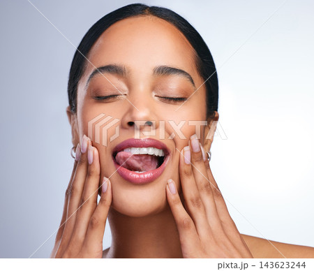 Woman, teeth and mouth with hands and smile for dental care, hygiene and oral health. Model girl, cosmetics and tongue or veneers for smile in studio with glow, wellness and results from cleaning Woman, teeth and mouth with hands and smile for dental care, hygiene and oral health. Model girl, cosmetics and tongue or veneers for smile in studio with glow, wellness and results from cleaning 143623244