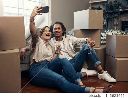 Couple, happy and selfie with boxes or champagne for moving, celebration and new home on floor. People, cardboard and alcohol drink for real estate, achievement and property with mortgage investment Couple, happy and selfie with boxes or champagne for moving, celebration and new home on floor. People, cardboard and alcohol drink for real estate, achievement and property with mortgage investment 143623663