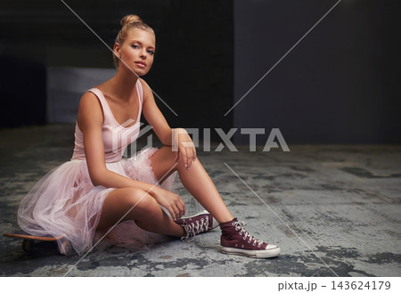 Edgy, ballet and portrait of woman with skateboard and sneakers for fashion, trendy outfit and hipster style. Parking lot, aesthetic and ballerina on floor for dance hobby, sports and skating skill Edgy, ballet and portrait of woman with skateboard and sneakers for fashion, trendy outfit and hipster style. Parking lot, aesthetic and ballerina on floor for dance hobby, sports and skating skill 143624179