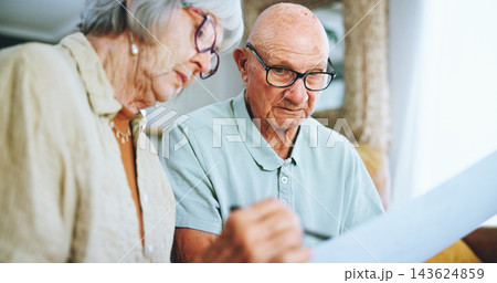 Senior couple, paperwork and reading in home for finance, life insurance and planning for assets. People, documents and application for mortgage loan, speaking and contract for investment policy Senior couple, paperwork and reading in home for finance, life insurance and planning for assets. People, documents and application for mortgage loan, speaking and contract for investment policy 143624859
