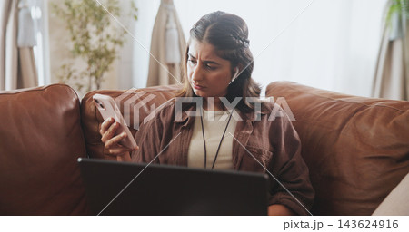 Thinking, woman and phone notification on sofa for entertainment, communication or internet browsing in home. Female person, thoughtful or concerned with laptop on couch for streaming or social media Thinking, woman and phone notification on sofa for entertainment, communication or internet browsing in home. Female person, thoughtful or concerned with laptop on couch for streaming or social media 143624916
