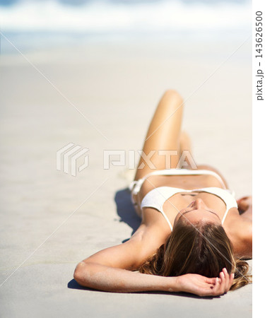 Beach, holiday and woman relaxing on sand in bikini for calm vacation or travel in summer. Peace, sleeping and female person laying by ocean or sea on tropical island for weekend trip in Australia. Beach, holiday and woman relaxing on sand in bikini for calm vacation or travel in summer. Peace, sleeping and female person laying by ocean or sea on tropical island for weekend trip in Australia. 143626500