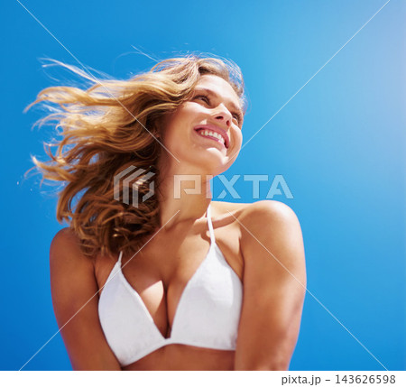 Woman, beach and bikini on blue sky for holiday, vacation and summer smile or ocean outdoor wind. Tourist, nature and Miami for confidence, clean air and weekend sea travel with swimsuit for water 143626598