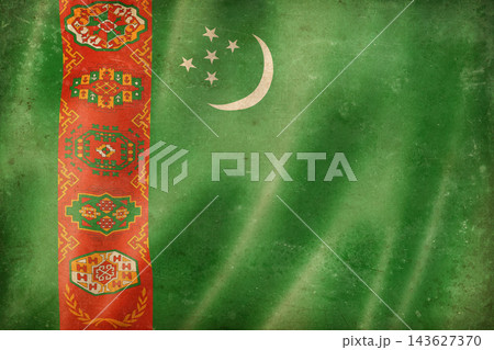 Old vintage flag of Turkmenistan, worn and stained 143627370