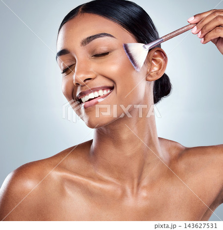 Woman, brush and happy with face for skincare makeup, product or facial care by tools in studio. Beauty, dermatology and cosmetics for girl model and smile, foundation or routine in grey background 143627531