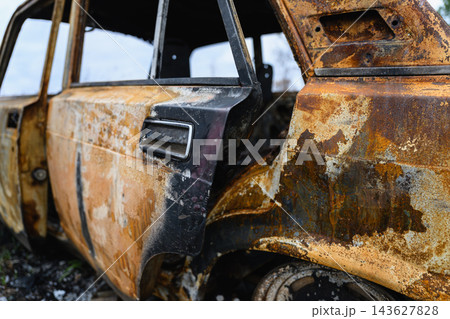 Rusty Burned Car With Open Door 143627828