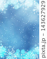 A Christmas background with bokeh and snowflakes in blue tones. 143627929