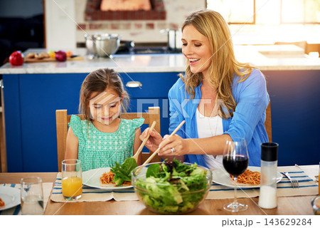 Love, food or mother and daughter in a house for lunch, conversation and bonding with organic meal. Salad, brunch or happy family at home with health, diet and nutrition on vacation, event or weekend Love, food or mother and daughter in a house for lunch, conversation and bonding with organic meal. Salad, brunch or happy family at home with health, diet and nutrition on vacation, event or weekend 143629284