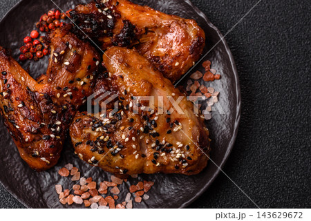 Grilled chicken wings with teriyaki sauce, seasoned with salt and spices. Chicken wings Grilled chicken wings with teriyaki sauce, seasoned with salt and spices. Chicken wings 143629672