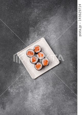 Sushi roll with tuna, rice, and cream cheese, served with soy sauce, wasabi, and ginger. Tuna roll Sushi roll with tuna, rice, and cream cheese, served with soy sauce, wasabi, and ginger. Tuna roll 143629714