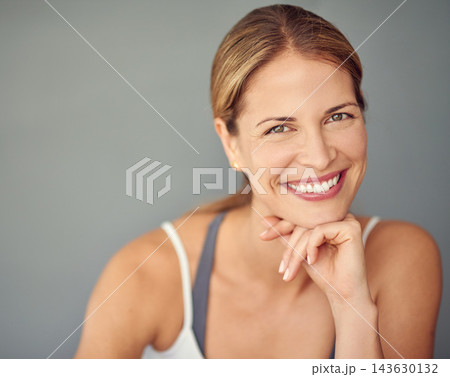 Portrait, smile and woman with fitness, happiness and healthy person on grey studio background. Face, model and athlete with wellness, mockup space and exercise with training, progress and balance 143630132