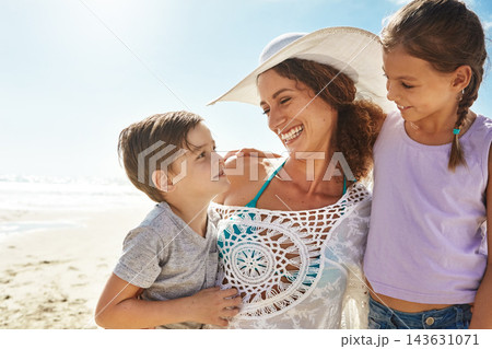 Beach, family and woman smile for holiday, fun and together with children for Australia adventure. Summer, ocean and vacation afternoon with happy mother, siblings and kids laughing in nature 143631071