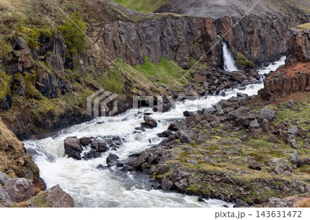 Hengifossa river rapids and waterfall in a rocky gorge in East Iceland in summer 143631472