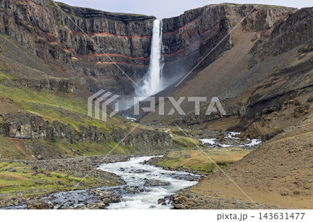 Hengifoss waterfall and Hengifossa river beneath red basalt strata in summer Iceland 143631477