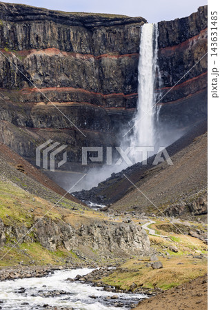 Hengifoss waterfall, red cliff bands and a summer hiking trail in East Iceland 143631485