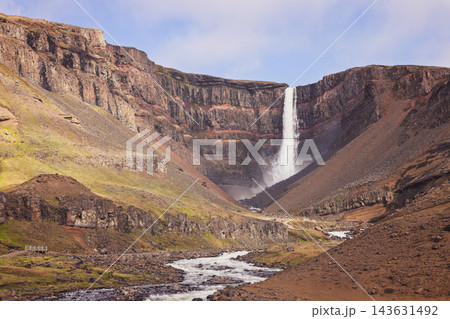 Hengifoss waterfall and red cliff strata above Hengifossa rapids in Iceland Hengifoss waterfall and red cliff strata above Hengifossa rapids in Iceland 143631492