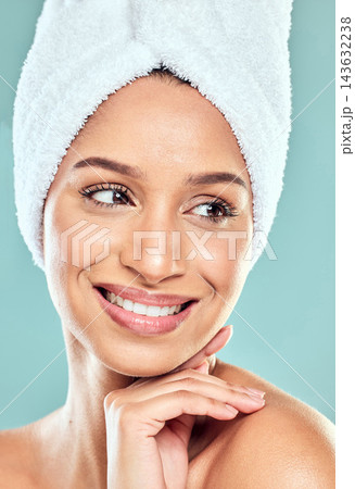 Happy woman, thinking and towel with hand in studio for shower, hygiene and smile for cleaning. Model girl, pride and idea for wellness, grooming and glow with routine and skincare by blue background Happy woman, thinking and towel with hand in studio for shower, hygiene and smile for cleaning. Model girl, pride and idea for wellness, grooming and glow with routine and skincare by blue background 143632238