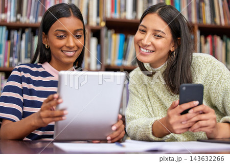 Student, friends and tablet in university library or online research as group project, learning or education. Woman, smile and bookshelf at college campus or teamwork for assignment, exam or studying 143632266