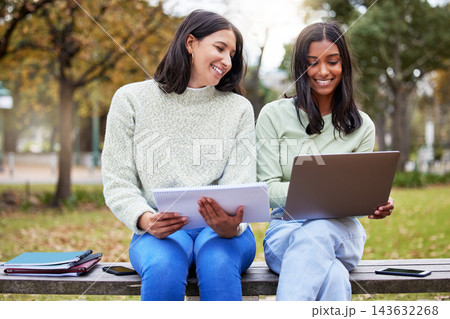 Students, laptop and friends in a park with learning, research and exam info on campus. Happy, school and university women with notes, online and college test with a computer outdoor on garden bench Students, laptop and friends in a park with learning, research and exam info on campus. Happy, school and university women with notes, online and college test with a computer outdoor on garden bench 143632268