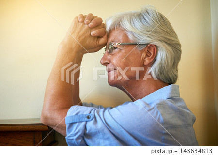Thinking, praying or senior woman with hope in with memory, trauma or fear in living room alone. Stress, remember or nervous elderly lady with decision, anxiety or depression in retirement or house 143634813