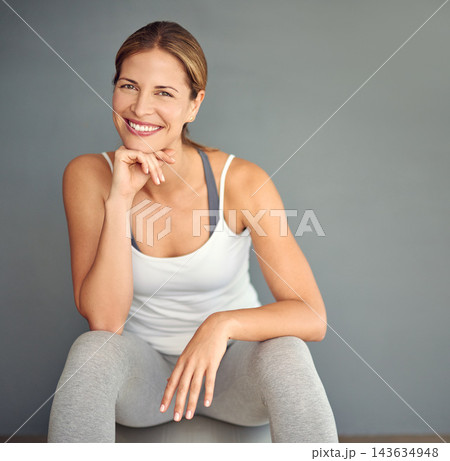 Portrait, ball and woman with fitness, exercise and healthy person on grey studio background. Face, model and athlete with balance, mockup space and challenge with training, progress and wellness 143634948