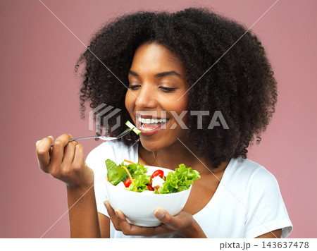 Healthy, eating and woman with salad for wellness, fresh and detox lunch meal with vegetables. Happy, diet and female person enjoying nutrition, vegan and organic food isolated by studio background. Healthy, eating and woman with salad for wellness, fresh and detox lunch meal with vegetables. Happy, diet and female person enjoying nutrition, vegan and organic food isolated by studio background. 143637478