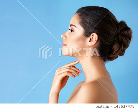 Profile, skincare and woman with beauty, shine and dermatology on blue studio background. Person, model and girl with grooming routine, cosmetics and treatment for glow, healthy skin and wellness 143637479