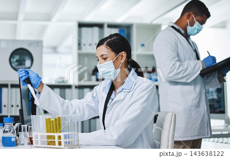 People, face mask and science or research team, medical laboratory and innovation or healthcare employee. Vaccine, pharmaceutical study and chemical experiment, test tube and scientists with lab coat People, face mask and science or research team, medical laboratory and innovation or healthcare employee. Vaccine, pharmaceutical study and chemical experiment, test tube and scientists with lab coat 143638122