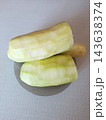 Peeled zucchini or squash vegetables showing raw ingredients ready for cooking, preparing healthy organic food in a kitchen environment 143638374