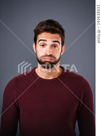 Studio, portrait and stress of man, tired and burnout with depression and moody with exhaustion. Gray background, face and person with brain fog, sad and bored in New York and mental health for guy Studio, portrait and stress of man, tired and burnout with depression and moody with exhaustion. Gray background, face and person with brain fog, sad and bored in New York and mental health for guy 143638931