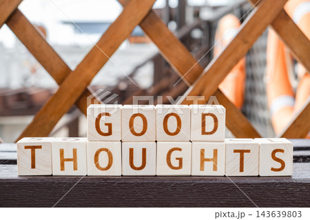 motivational word Good thoughts, from letters on wooden cubes 143639803