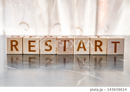 motivational word Restart, from letters on wooden cubes motivational word Restart, from letters on wooden cubes 143639814