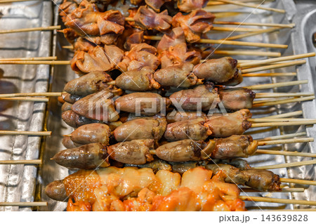 fried chicken hearts and stomachs on sticks 143639828