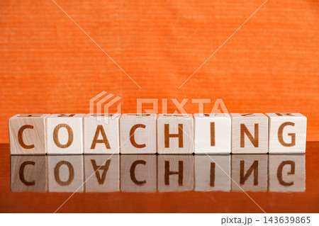 word Coaching, from letters on wooden cubes word Coaching, from letters on wooden cubes 143639865