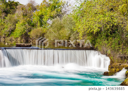 wide waterfall on river, blurred movement of water, long exposure wide waterfall on river, blurred movement of water, long exposure 143639885
