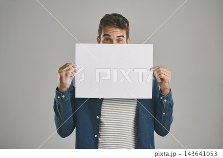 Man, portrait and poster or information mockup in studio for announcement placard, advertising or grey background. Male person, banner and billboard sign for deal or bulletin, ambassador or choice 143641053