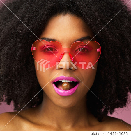 Portrait, chocolate and woman with glasses, fashion and shades with sweet treat, beauty and confidence. Face, person and girl with funky eyewear, heart shape and cocoa with style, retro and casual Portrait, chocolate and woman with glasses, fashion and shades with sweet treat, beauty and confidence. Face, person and girl with funky eyewear, heart shape and cocoa with style, retro and casual 143641083