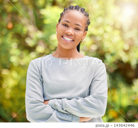 Happy, black woman and portrait with confidence in nature for summer or eco friendly environment at park. Face of young African or female person with smile or arms crossed for day in outdoor sunshine Happy, black woman and portrait with confidence in nature for summer or eco friendly environment at park. Face of young African or female person with smile or arms crossed for day in outdoor sunshine 143642446