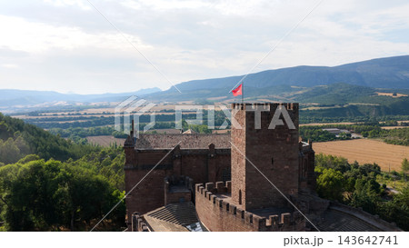Javier Castle tower flying red flag overlooking Navarre landscape Javier Castle tower flying red flag overlooking Navarre landscape 143642741