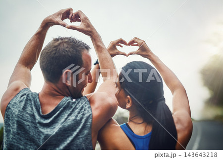 Back, people and couple with heart sign for fitness, workout and exercise with health. Relationship, outdoor and happy on break with routine or activity for wellbeing, wellness and self care 143643218